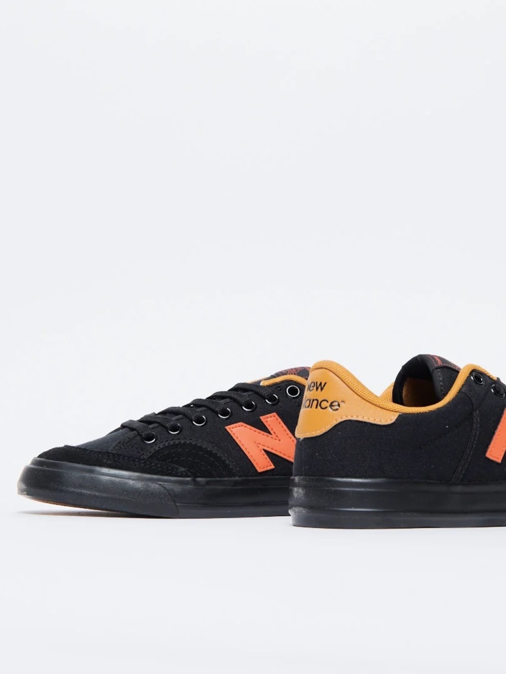 New Balance Black Sneakers with Orange Accents